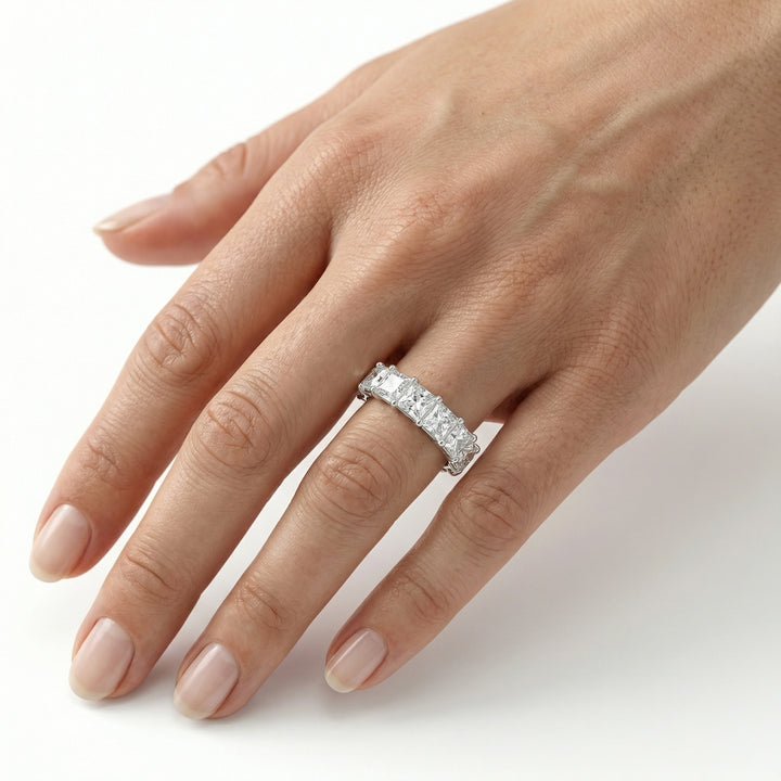 Cushion Cut Eternity Ring in platinum on ring finger