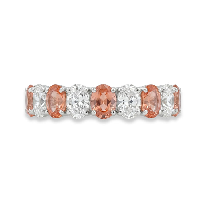 Platinum oval cut eternity ring with alternating diamond and Padparadscha sapphires
