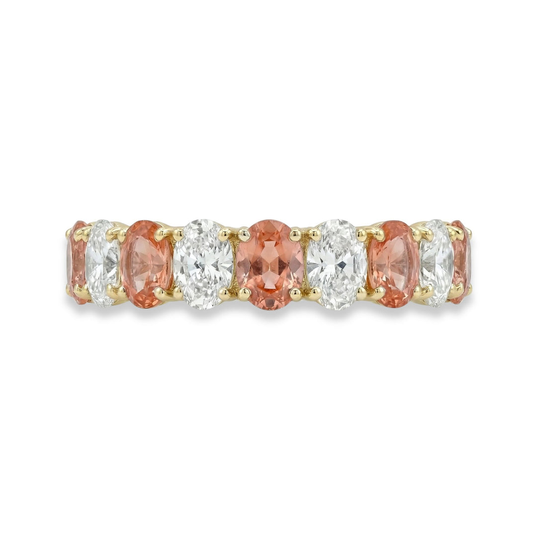 18K Yellow gold oval cut eternity ring with alternating diamond and Padparadscha sapphires