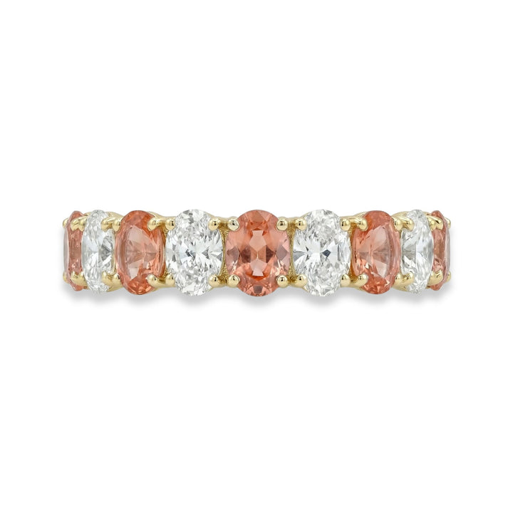 18K Yellow gold oval cut eternity ring with alternating diamond and Padparadscha sapphires