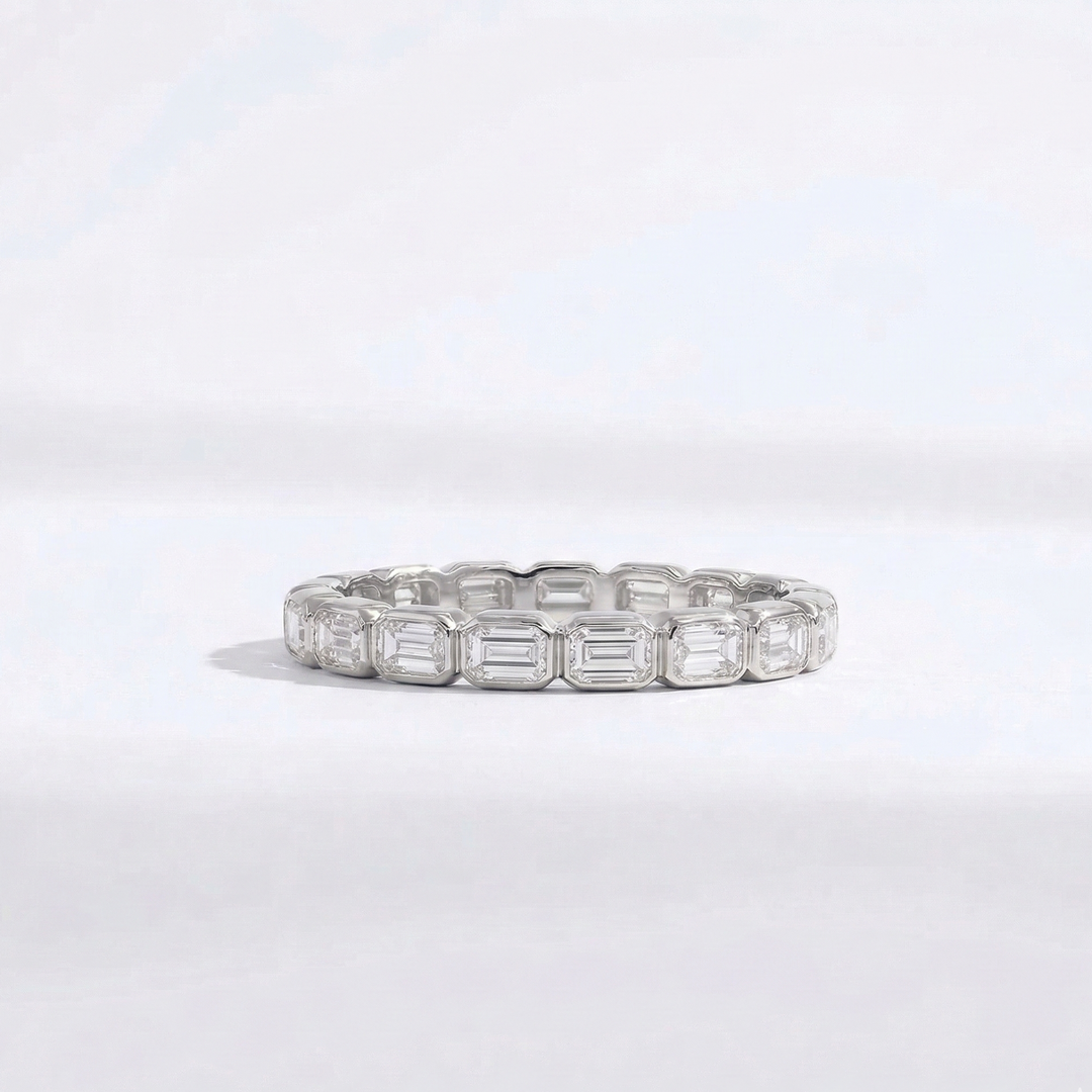 Platinum emerald-cut diamond eternity ring handcrafted by M Grace Jewelry