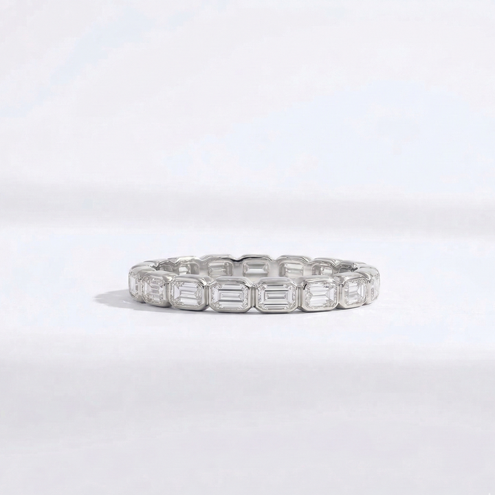 Platinum emerald-cut diamond eternity ring handcrafted by M Grace Jewelry