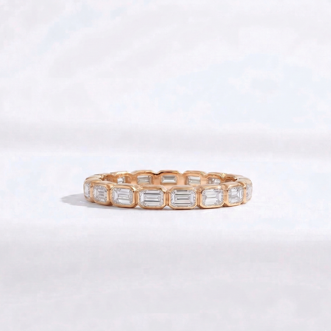 Rose gold emerald-cut diamond eternity ring handcrafted by M Grace Jewelry