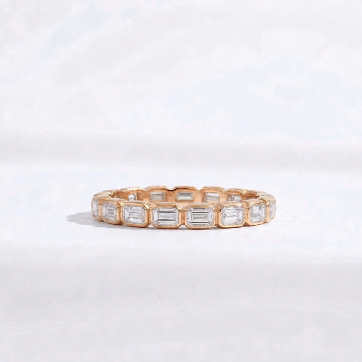 Rose gold emerald-cut diamond eternity ring handcrafted by M Grace Jewelry