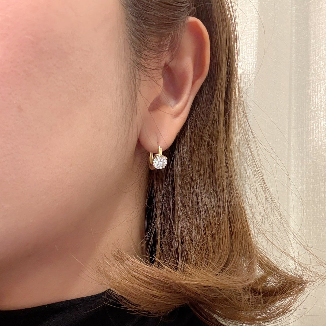 Gold diamond hoop earrings, vertical prong setting worn — M Grace Jewelry