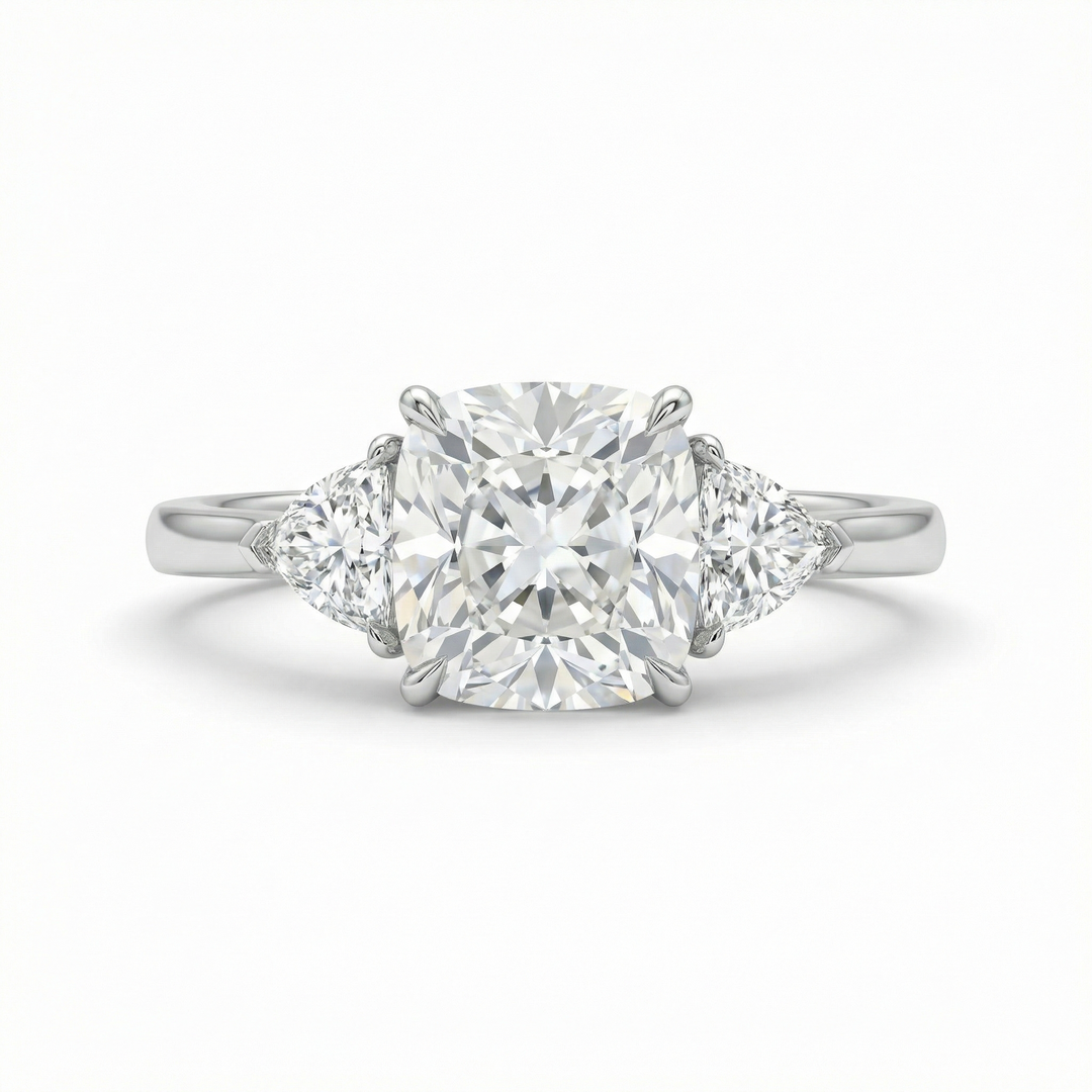 Platinum cushion-cut and trillion three-stone diamond ring — M Grace Jewelry