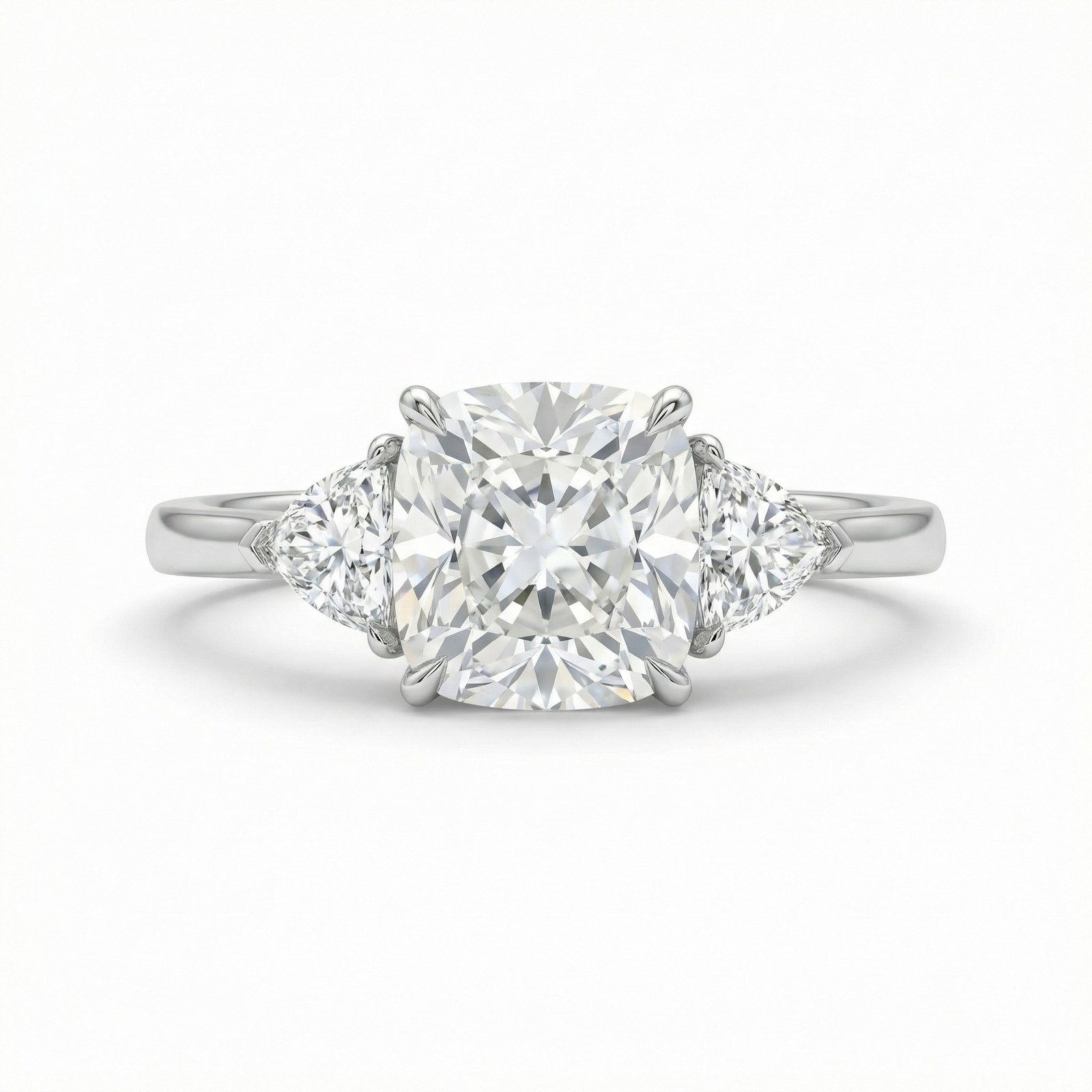 Platinum cushion-cut and trillion three-stone diamond ring — M Grace Jewelry