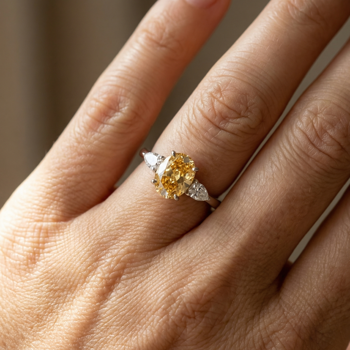 Fancy Intense Yellow oval diamond ring in platinum by M Grace Jewelry