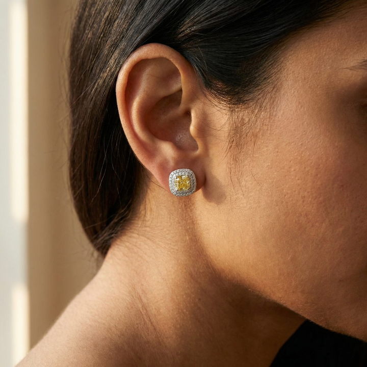 Fancy Intense Yellow cushion drop earrings in platinum, M Grace Jewelry