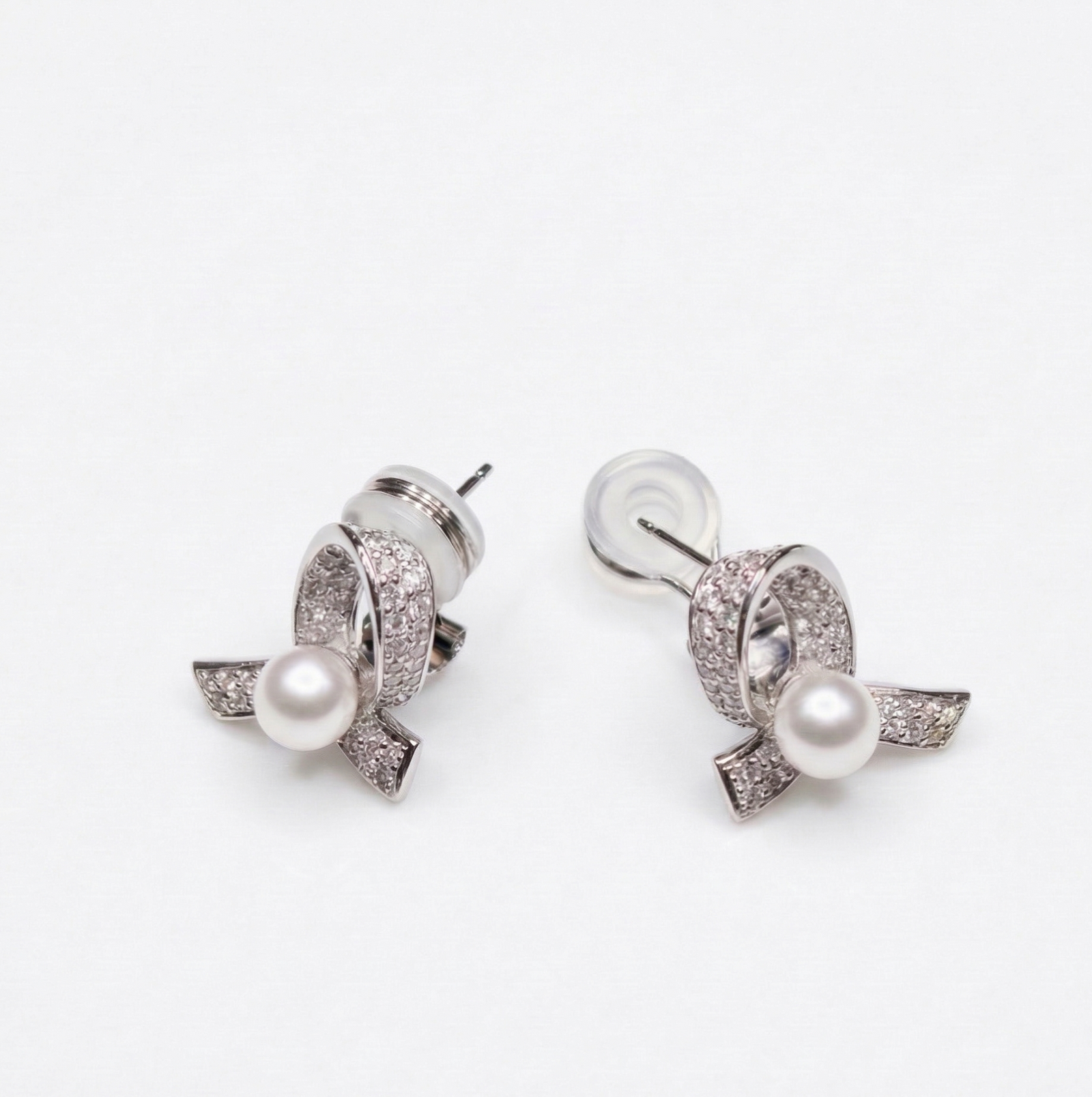 Platinum Akoya pearl and diamond ribbon drop earrings by M Grace Jewelry