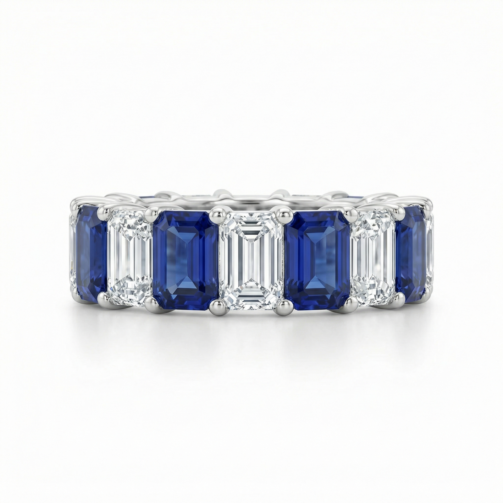 Royal blue sapphire and diamond emerald-cut eternity ring by M Grace Jewelry