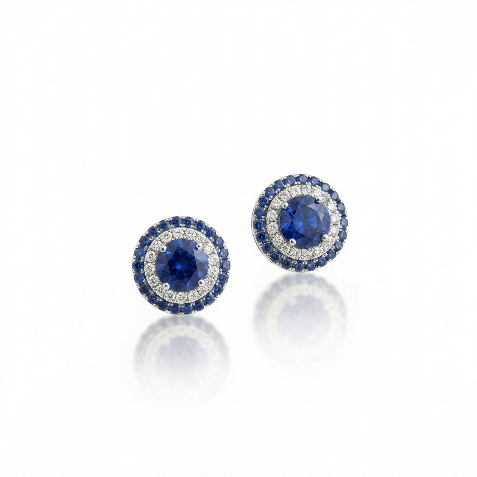 Platinum double-halo sapphire and diamond stud earrings by M Grace Jewelry