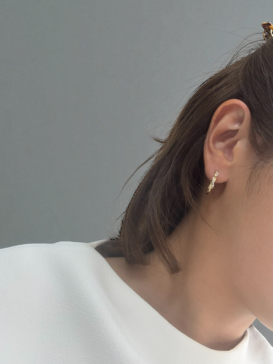 18K yellow gold twisted diamond hoop earrings by M Grace Jewelry