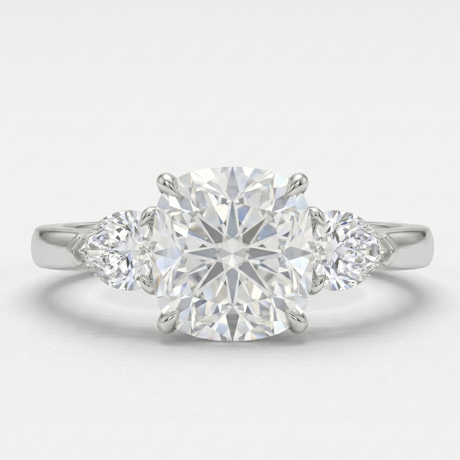 Cushion Cut with 2 Pear Shape Cut Ring in Platinum | M Grace Jewelry