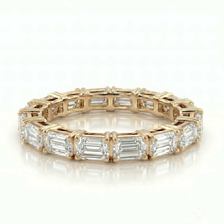 Axis Emerald Eternity Ring in 18K Yellow Gold | M Grace Jewelry