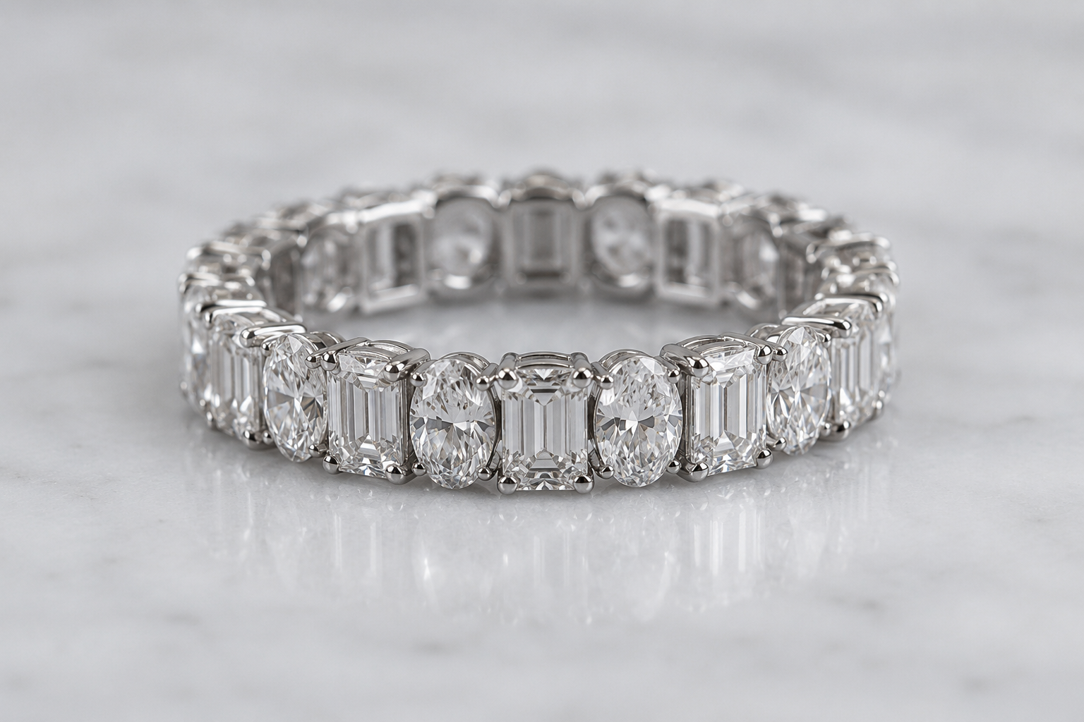 Emerald Oval Rhythm Eternity Ring in Platinum | M Grace Jewelry